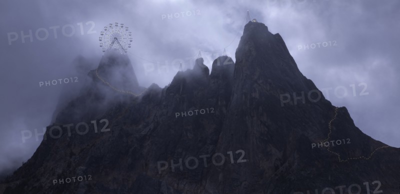 Ferris wheel on rocky mountaintop