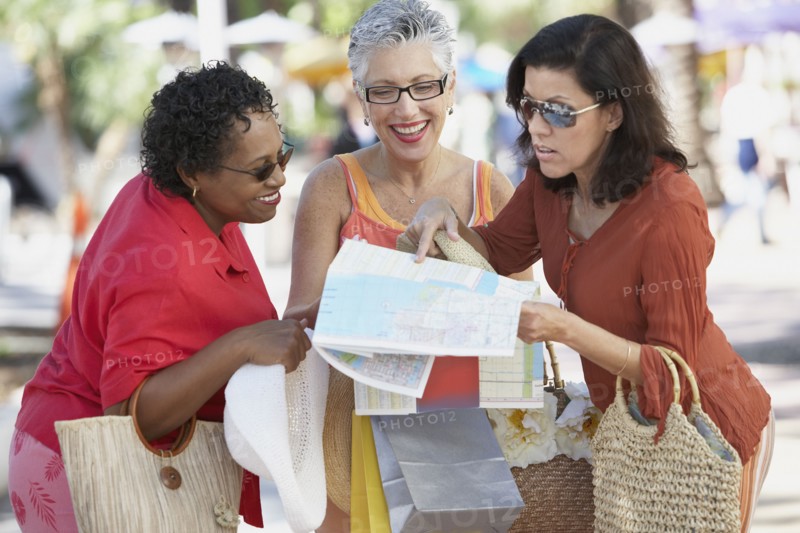 Group of middle-aged women looking at a map