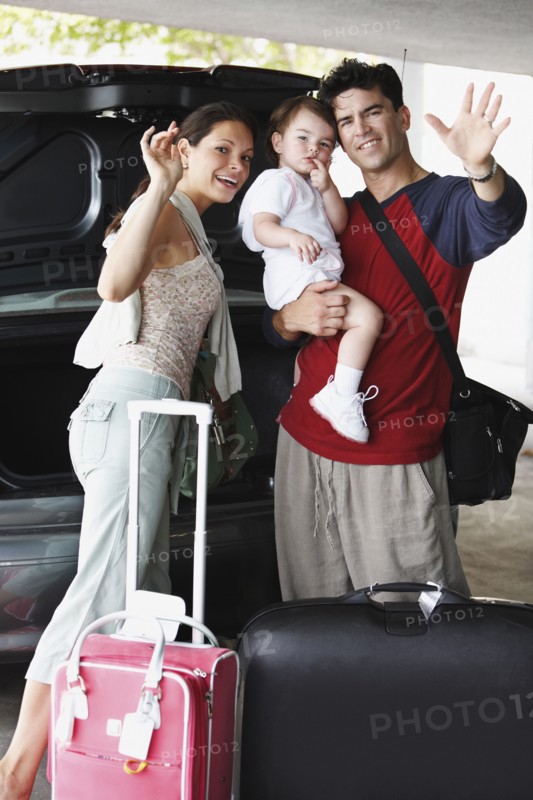 Hispanic family going on trip and waving
