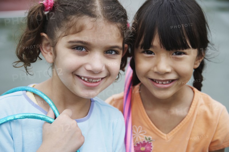 Close up of multi-ethnic girls smiling