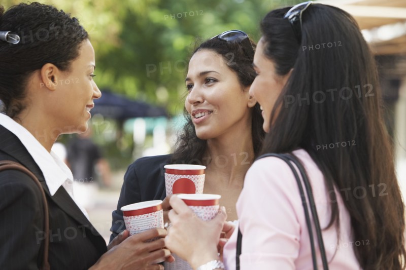 Multi-ethnic friends having coffee