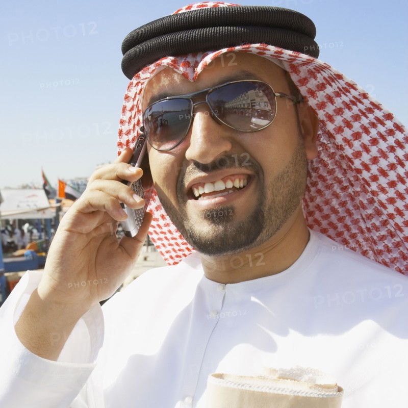Close up of Arab man talking on cell phone