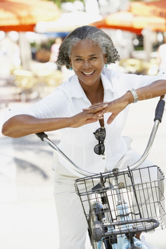 African woman riding bicycle