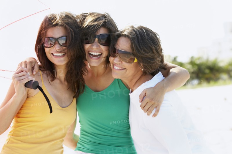 Mother and sisters hugging