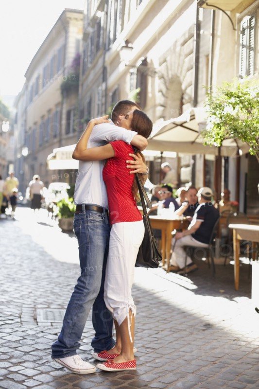 Couple hugging outdoors