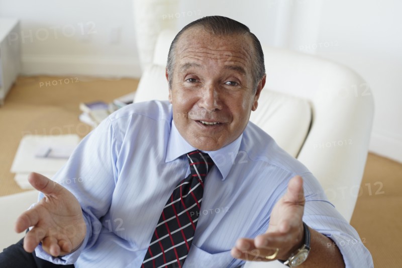 Hispanic businessman shrugging