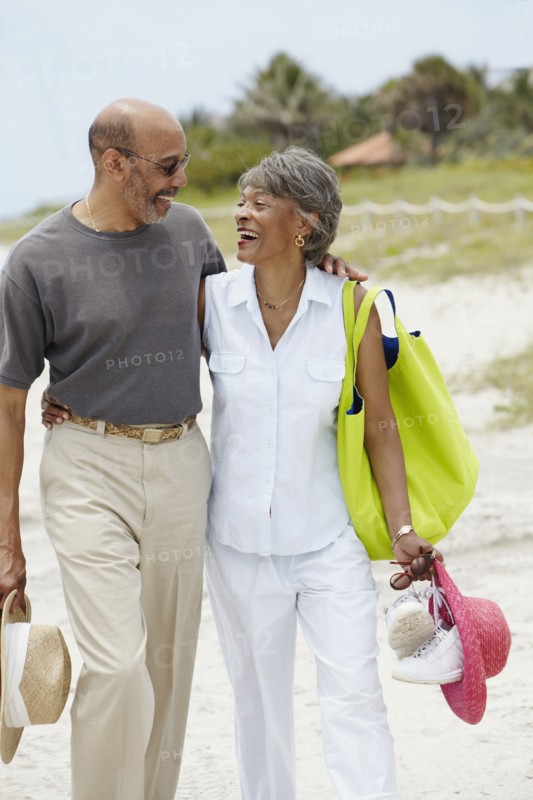 African couple walking on beach