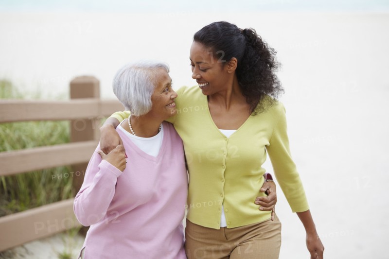 African American woman walking with mother