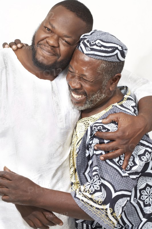 African American father and son hugging