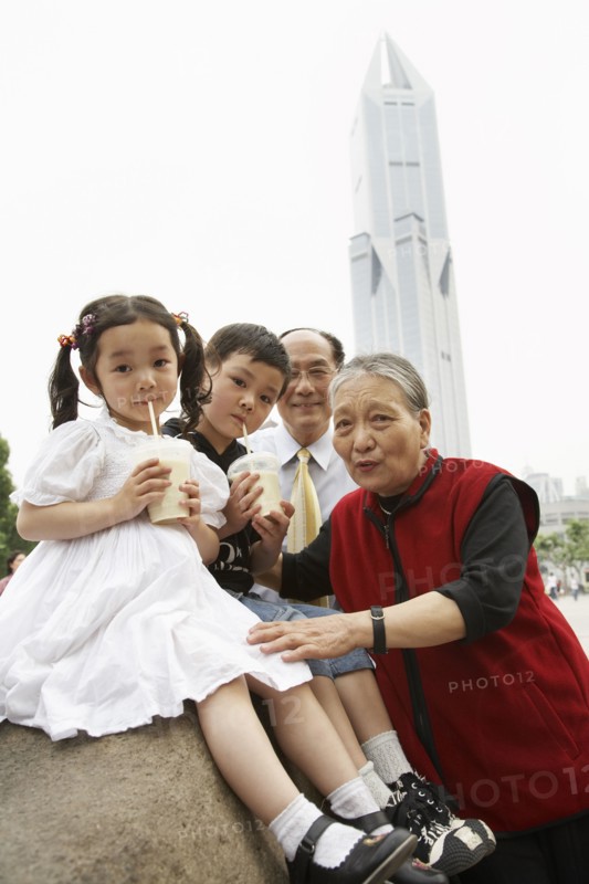 Chinese grandparents enjoying grandchildren