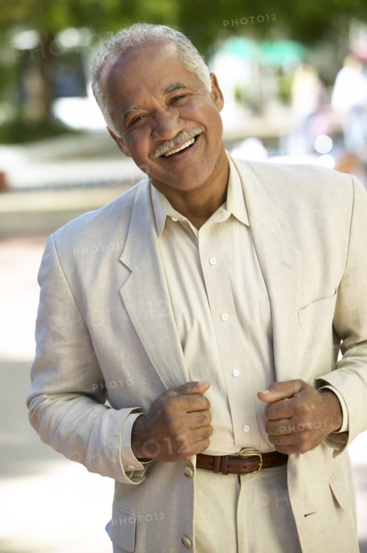 Smiling mixed race man standing outdoors