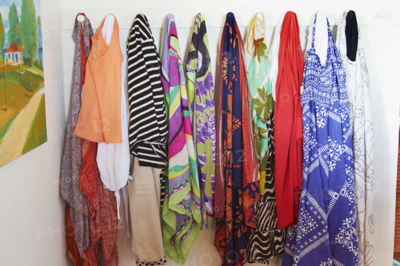 Clothes hanging on pegs