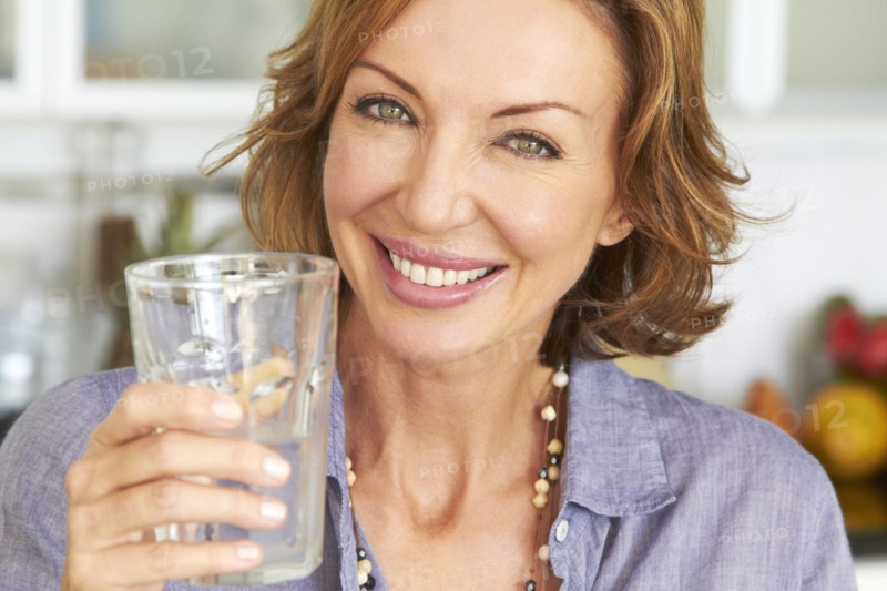 Caucasian woman drinking water