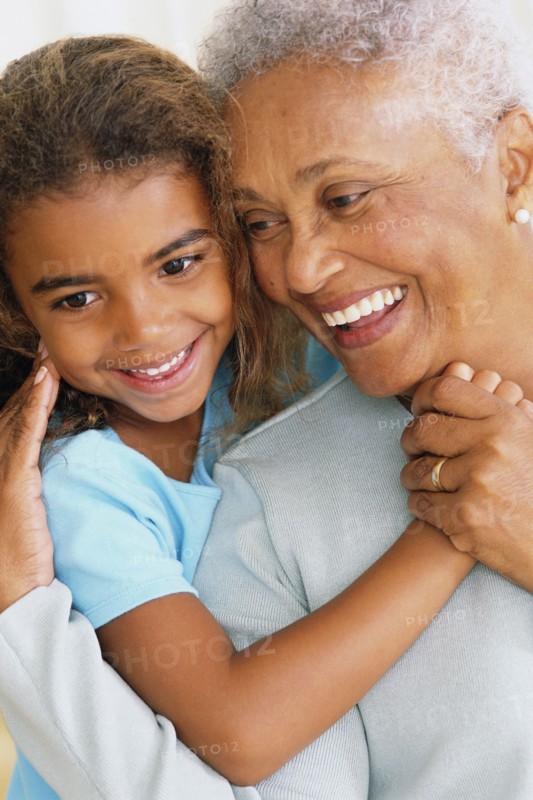 Senior woman and granddaughter touching noses