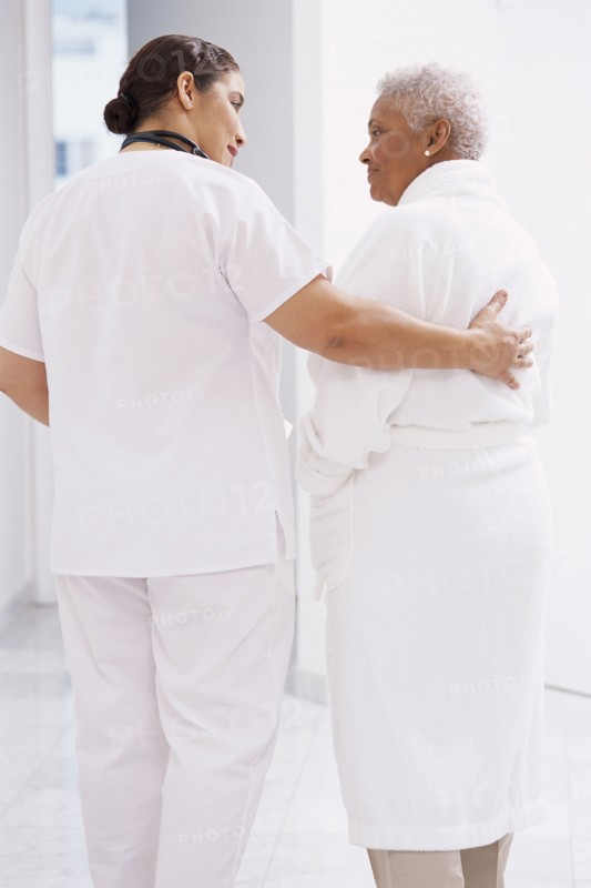 Nurse comforting Senior patient in hospital