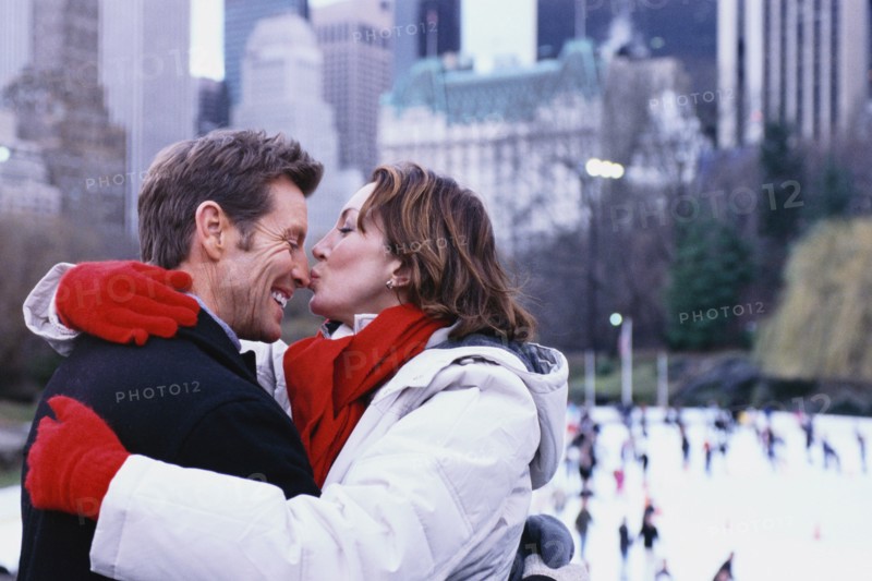 Couple kissing outside Rockefeller Center