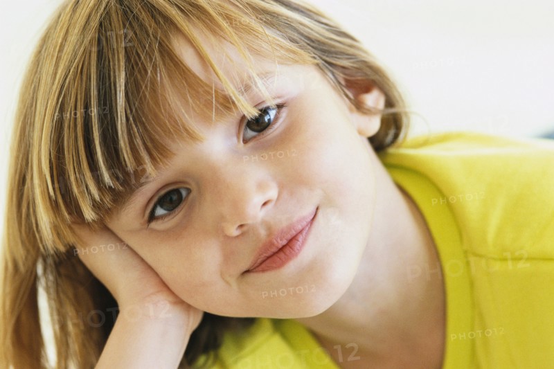 Girl resting head on hand