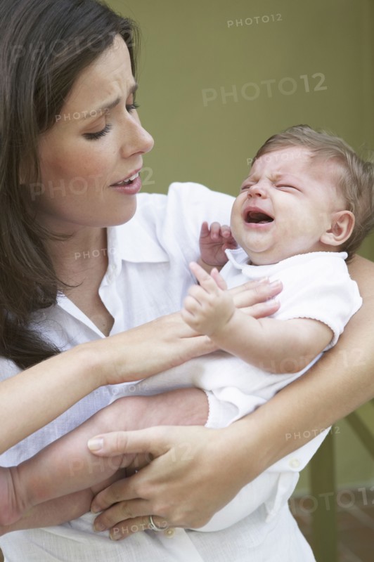 Mother comforting crying baby