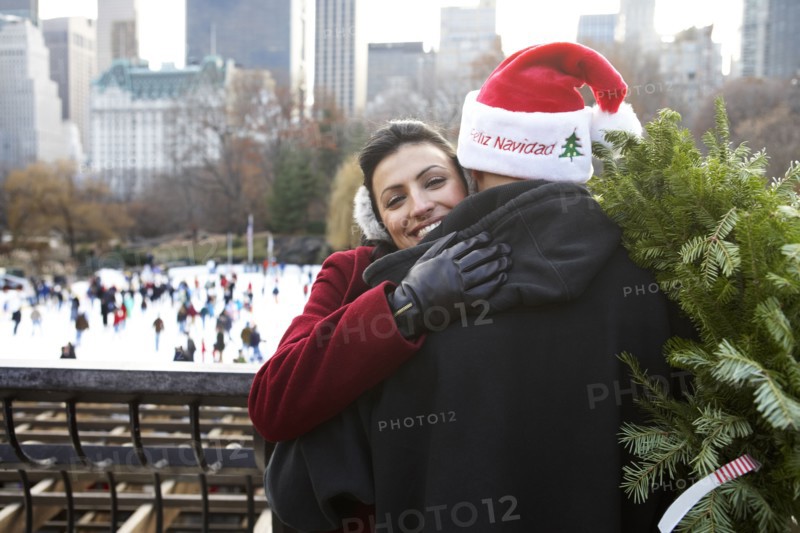Couple hugging on city street