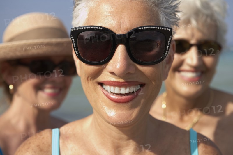 Senior woman wearing sunglasses on beach