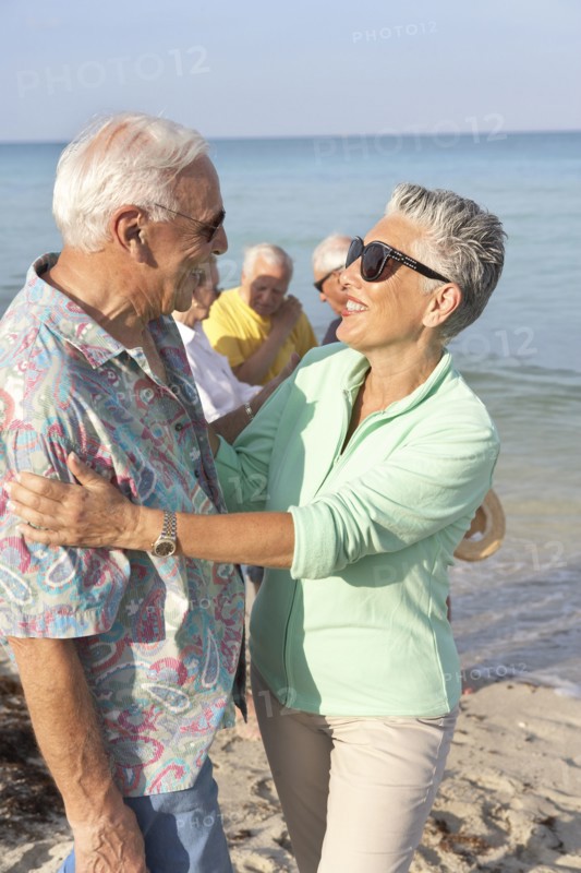 Senior couple hugging on beach