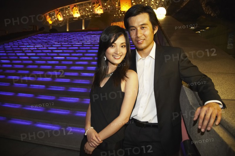 Couple outside Oriental Pearl Tower at night