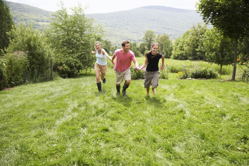 Family walking together in backyard