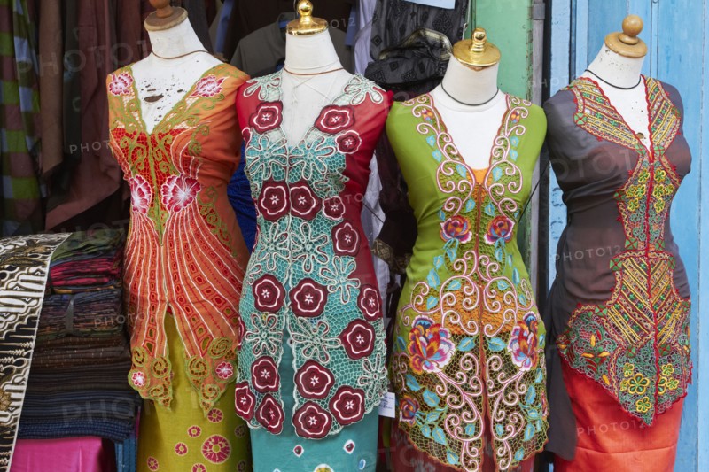 Traditional sarongs on mannequins at market