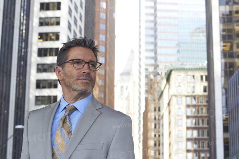 Caucasian businessman standing in city