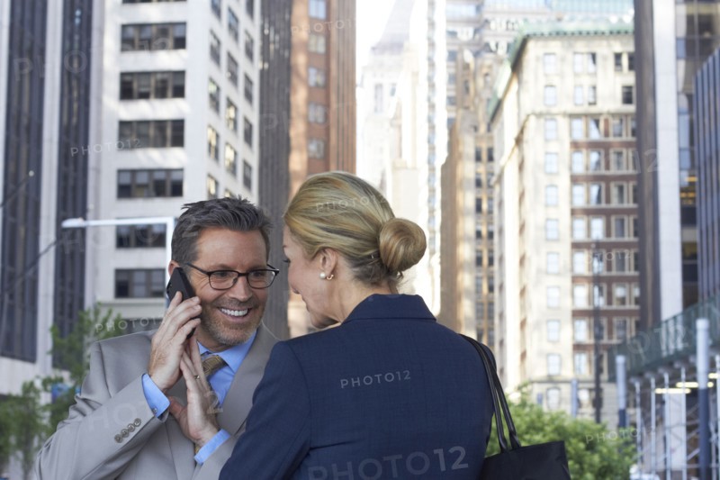 Caucasian business people talking in city