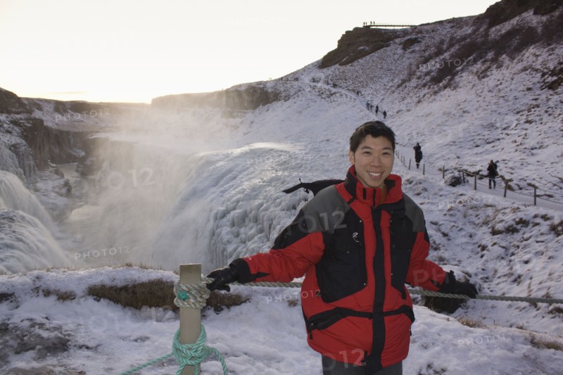 Chinese man standing on remote ice field