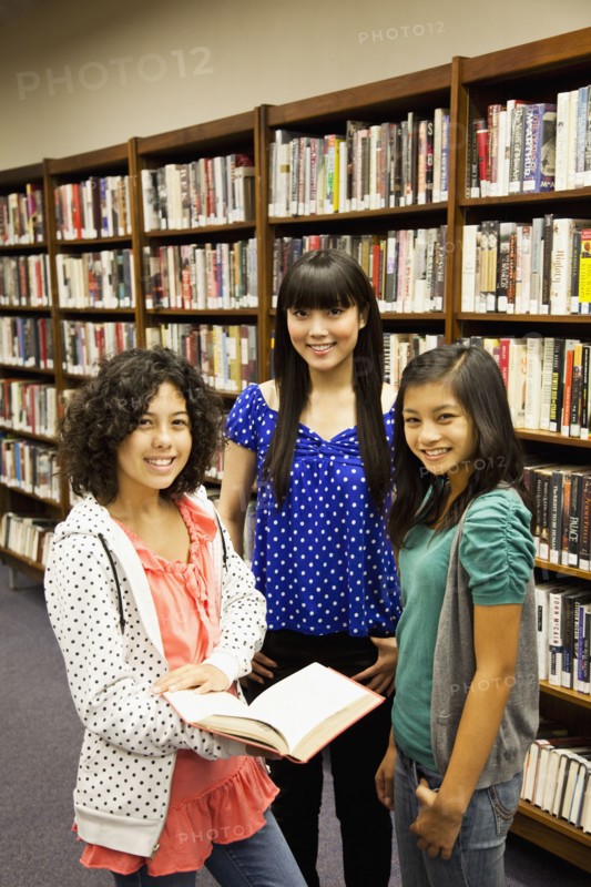 Girls standing in library