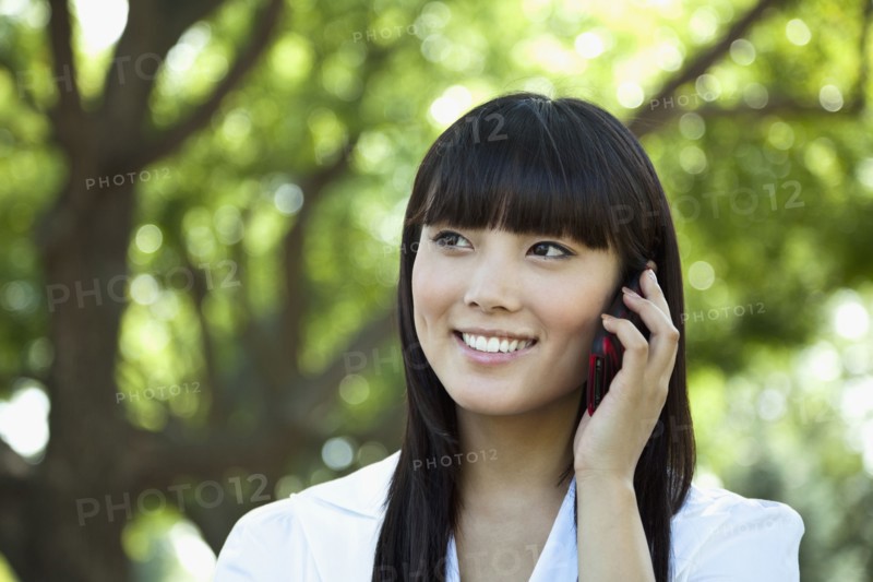 Asian woman talking on cell phone