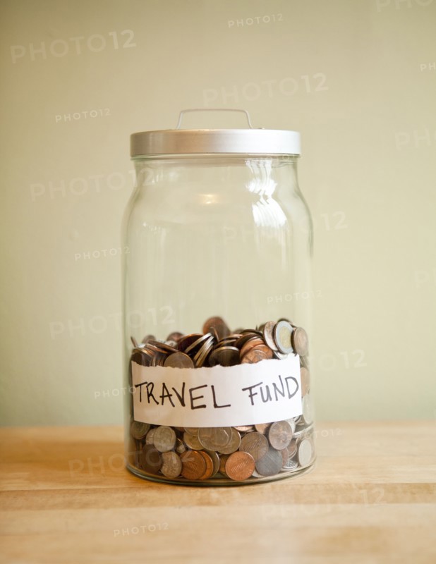 Coins in 'travel fund' jar