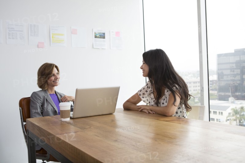 Businesswomen talking in office