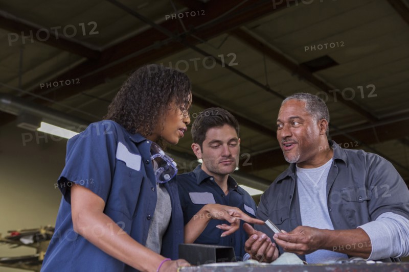 Workers talking in warehouse