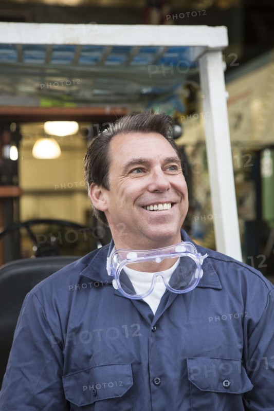 Caucasian worker smiling in warehouse