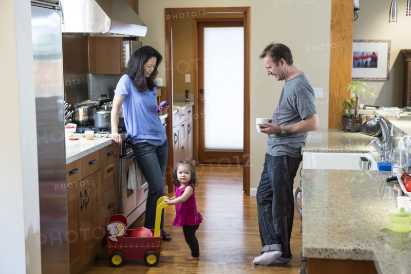 Family relaxing in kitchen