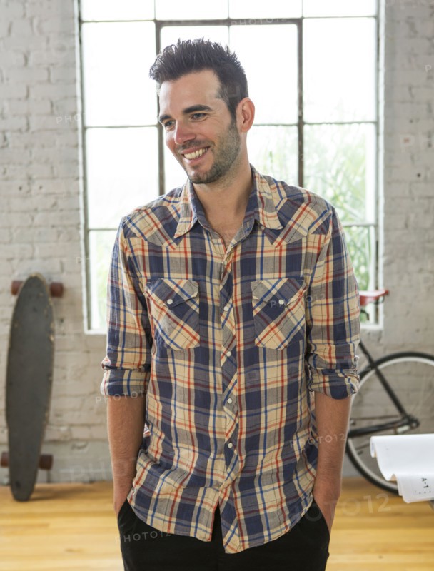 Caucasian man smiling in loft