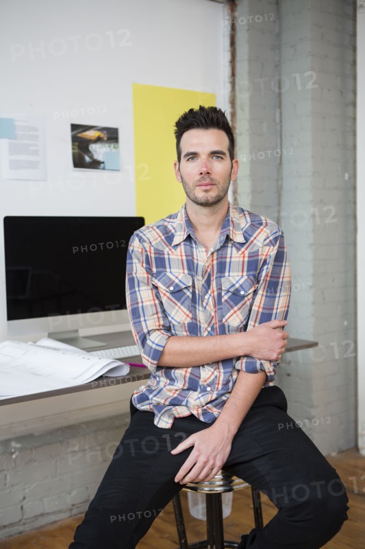 Caucasian architect sitting in office