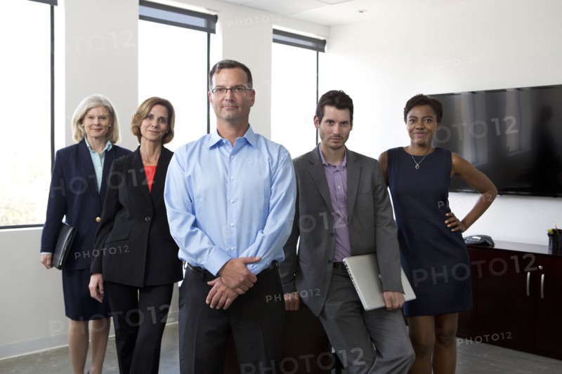 Business people smiling together in office