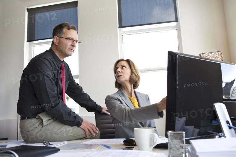 Caucasian business people talking in office