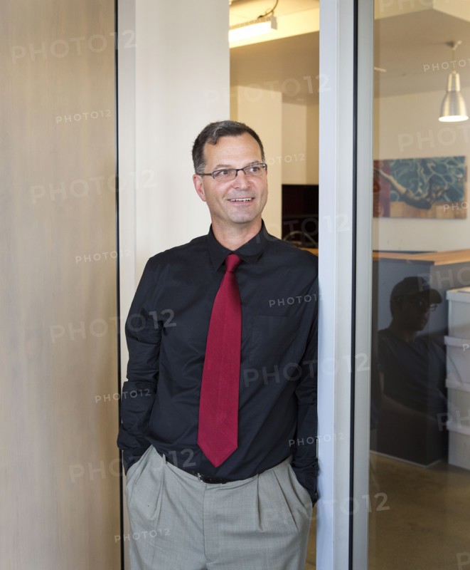 Caucasian businessman smiling in office