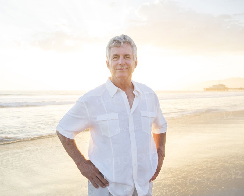 Caucasian man smiling on beach