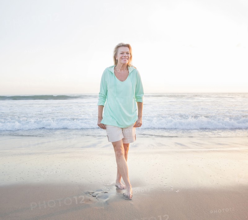 Caucasian woman smiling on beach