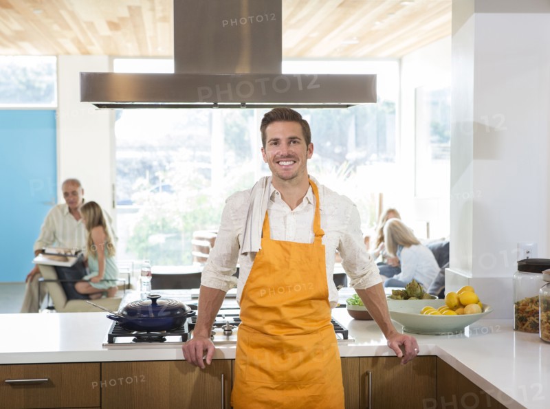 Caucasian man smiling in kitchen
