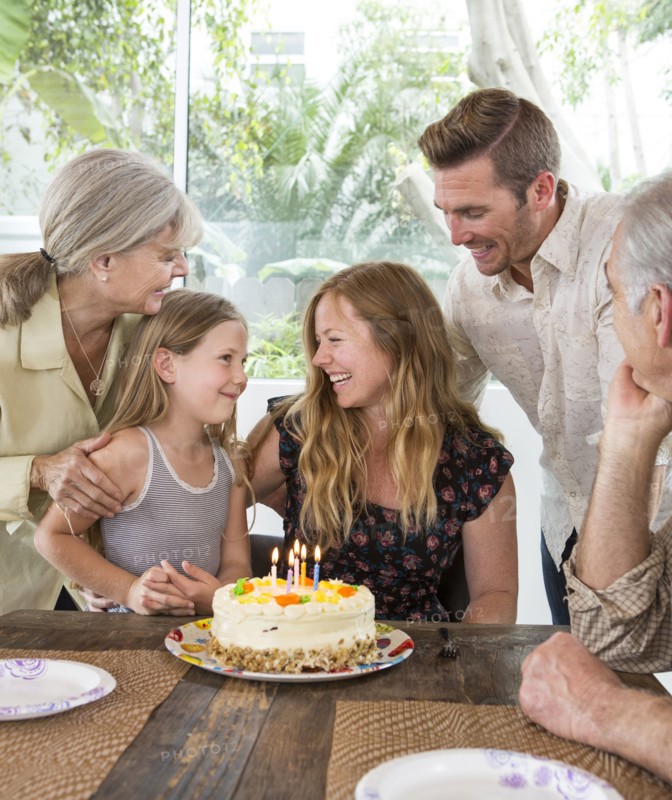 Caucasian family celebrating birthday at table