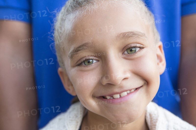 Close up of smiling girl with father