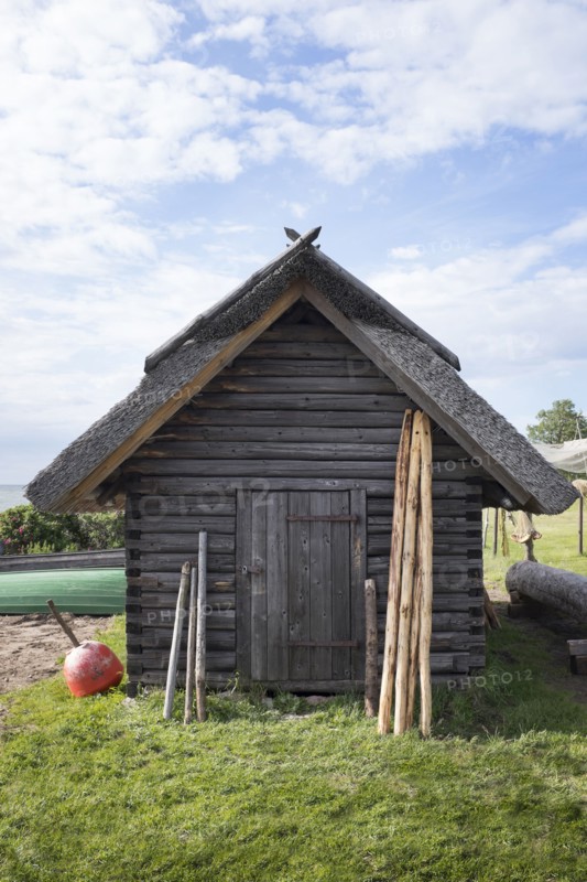 Wood shed under clouds