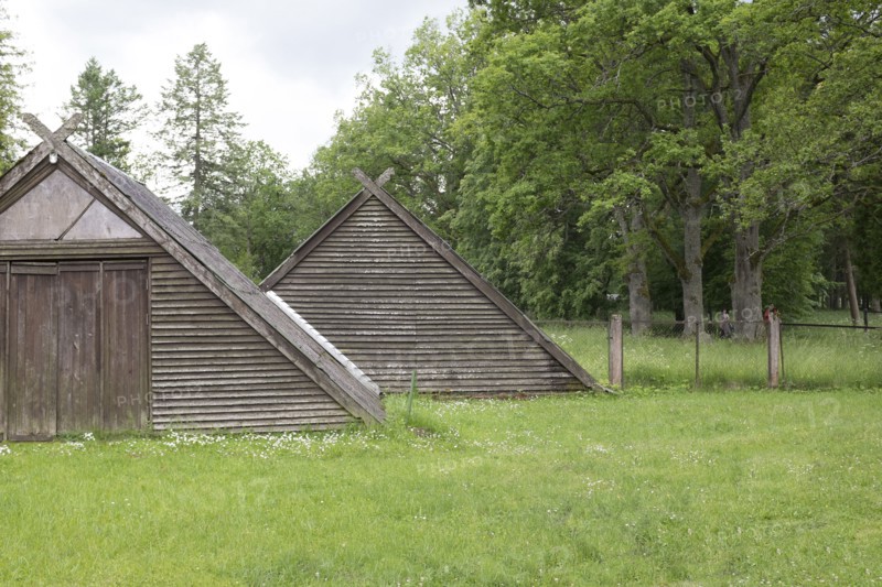 Traditional wooden buildings in field